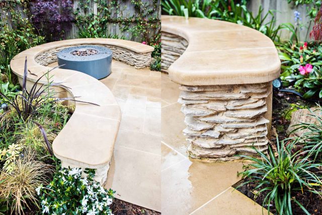 Family Garden with summer house in West London Feltham, curved seating bench, Charcoal Norstone tiered walling, specialist garden contractors horticulturists.