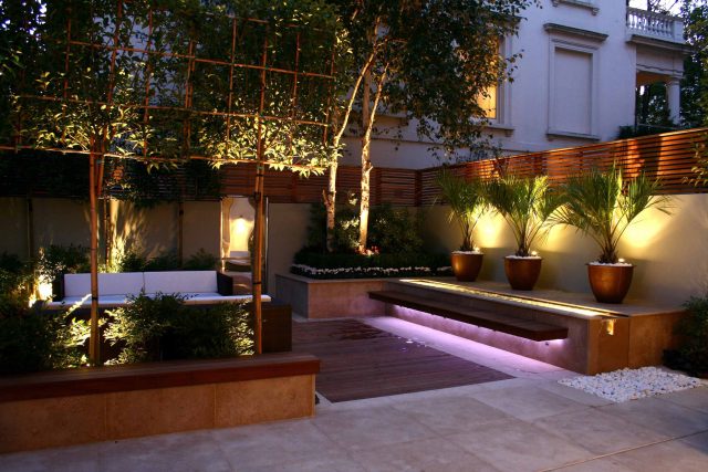 Contemporary outdoor garden space designed by Kate Gould and built by the Garden Builders, water feature, floating bench, cedar bench, landscaping contractors.