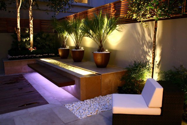 Contemporary outdoor garden space designed by Kate Gould and built by the Garden Builders, water feature, floating bench, cedar bench, landscaping contractors.