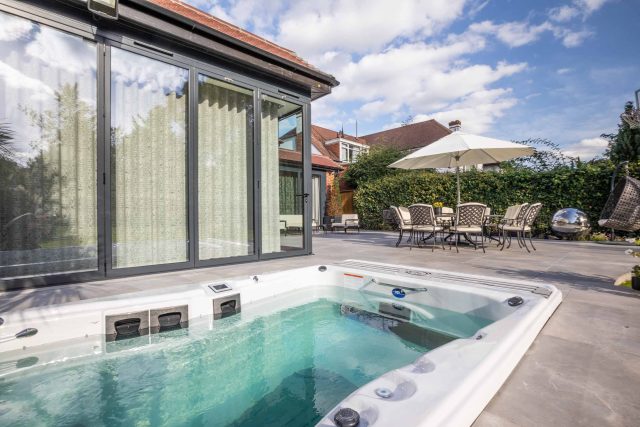 This lovely, large family garden in North London was designed by the garden landscaper, The Garden Builders. It offers free flowing curves and spiral shapes.