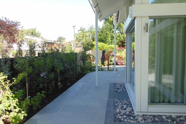 Blackheath Design, Hauf House, living green wall, dark granite edge detail, solid Oak automated gates a specialist garden contractors landscaping company.