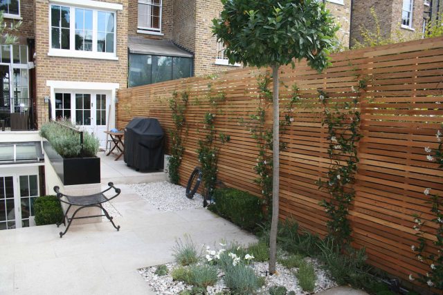 Garden Designer Chelsea Chic Modern Refinement Charm Landscape Contractor with steps sleek lines and flooring was laid with white limestone by Declan Buckley.