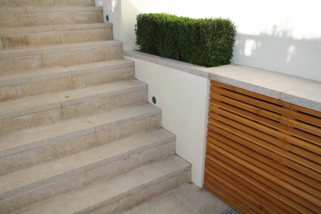 Garden Designer Chelsea Chic Modern Refinement Charm Landscape Contractor with steps sleek lines and flooring was laid with white limestone by Declan Buckley.