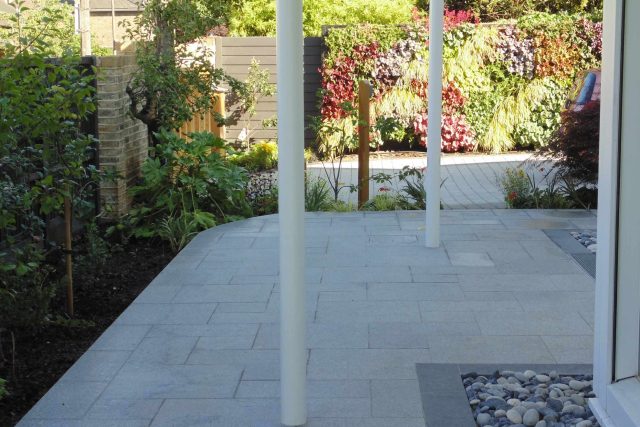 Blackheath Design, Hauf House, living green wall, dark granite edge detail, solid Oak automated gates a specialist garden contractors landscaping company.