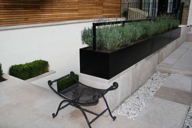 Garden Designer Chelsea Chic Modern Refinement Charm Landscape Contractor with steps sleek lines and flooring was laid with white limestone by Declan Buckley.