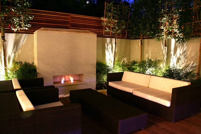 Contemporary outdoor garden space designed by Kate Gould and built by the Garden Builders, water feature, floating bench, cedar bench, landscaping contractors.