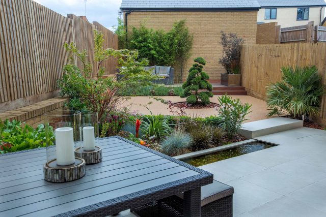 Japanese style garden, designed and constructed by The Garden Builders floor levels and planting geometry white porcelain tiles landscape company wood decking.