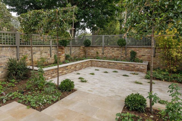 Elegant airy west London traditional contemporary garden by designer Camilla Hiley, urban with rustic country touches landscaping specialists in planting.