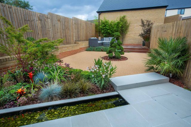 Japanese style garden, designed and constructed by The Garden Builders floor levels and planting geometry white porcelain tiles landscape company wood decking.