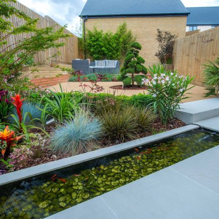Japanese style garden, designed and constructed by The Garden Builders floor levels and planting geometry white porcelain tiles landscape company wood decking.