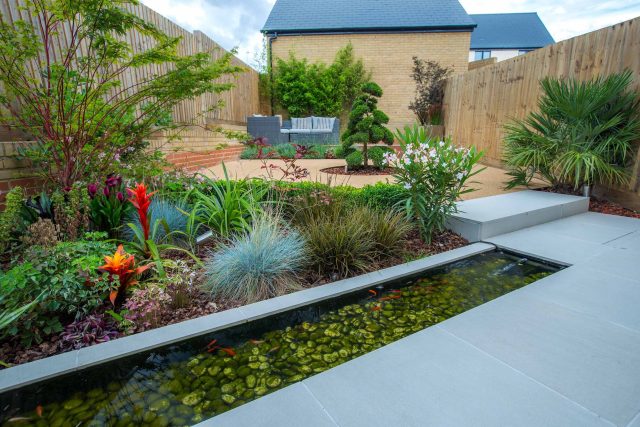 Japanese style garden, designed and constructed by The Garden Builders floor levels and planting geometry white porcelain tiles landscape company wood decking.