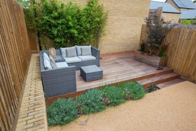 Japanese style garden, designed and constructed by The Garden Builders floor levels and planting geometry white porcelain tiles landscape company wood decking.