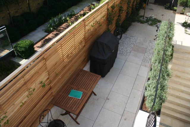 Garden Designer Chelsea Chic Modern Refinement Charm Landscape Contractor with steps sleek lines and flooring was laid with white limestone by Declan Buckley.
