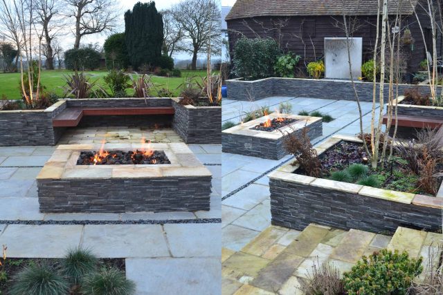 Contemporary courtyard garden in a rural setting paving riven grey sand stone and black polished pebbles, floating hardwood built-in bench seat Hertfordshire.