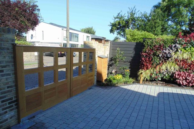 Blackheath Design, Hauf House, living green wall, dark granite edge detail, solid Oak automated gates a specialist garden contractors landscaping company.