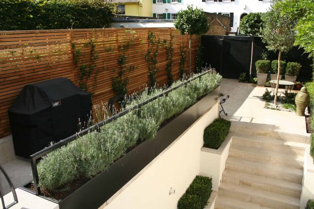 Garden Designer Chelsea Chic Modern Refinement Charm Landscape Contractor with steps sleek lines and flooring was laid with white limestone by Declan Buckley.