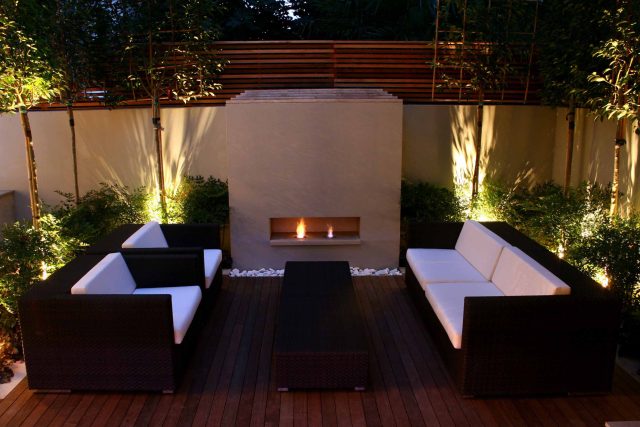 Contemporary outdoor garden space designed by Kate Gould and built by the Garden Builders, water feature, floating bench, cedar bench, landscaping contractors.