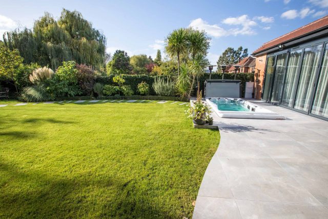 This lovely, large family garden in North London was designed by the garden landscaper, The Garden Builders. It offers free flowing curves and spiral shapes.