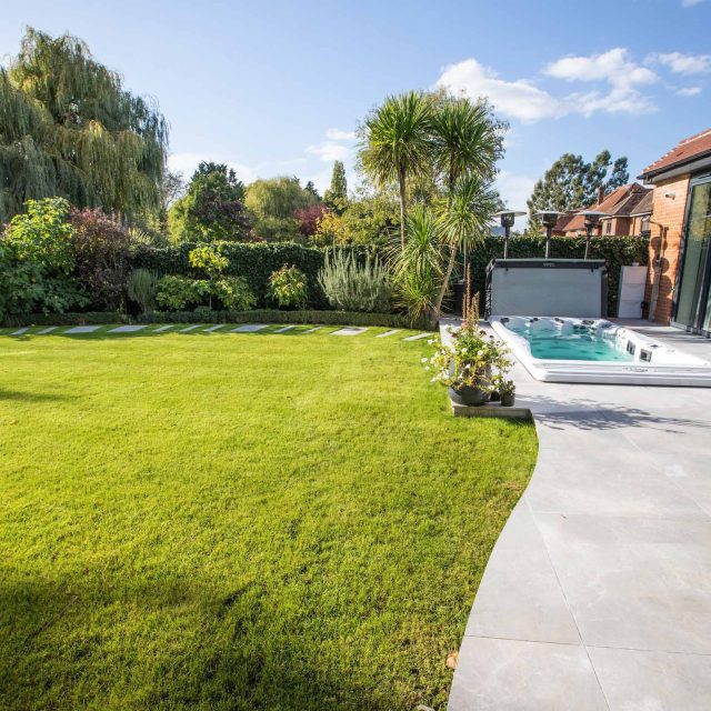 This lovely, large family garden in North London was designed by the garden landscaper, The Garden Builders. It offers free flowing curves and spiral shapes.