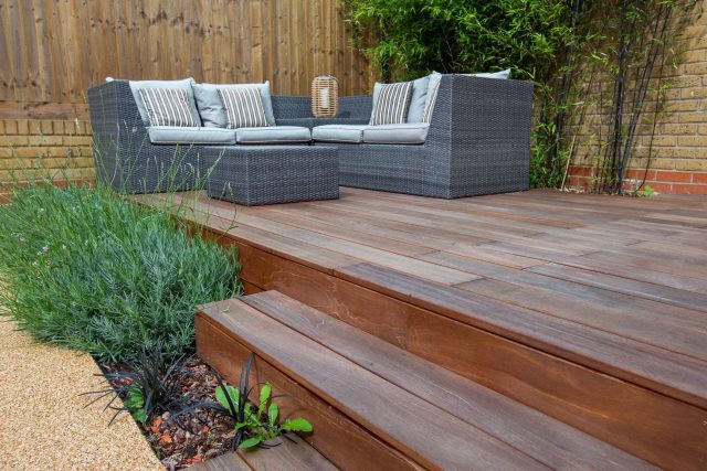 Japanese style garden, designed and constructed by The Garden Builders floor levels and planting geometry white porcelain tiles landscape company wood decking.