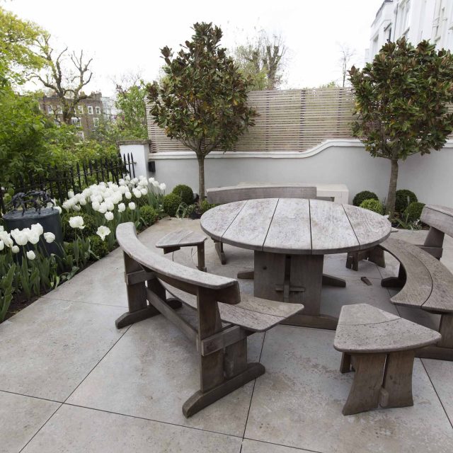 Contemporary yet elegant garden design in Notting Hill, with good entertaining space, slate water feature and sculpture, beautiful communal garden landscaper.