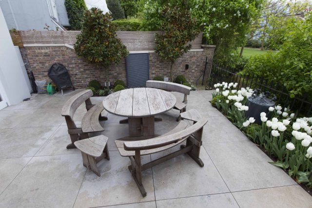 Contemporary yet elegant garden design in Notting Hill, with good entertaining space, slate water feature and sculpture, beautiful communal garden landscaper.