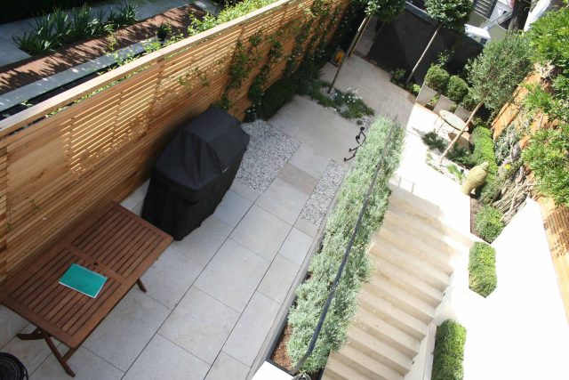 Garden Designer Chelsea Chic Modern Refinement Charm Landscape Contractor with steps sleek lines and flooring was laid with white limestone by Declan Buckley.