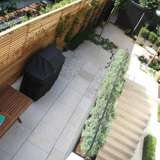 Garden Designer Chelsea Chic Modern Refinement Charm Landscape Contractor with steps sleek lines and flooring was laid with white limestone by Declan Buckley.