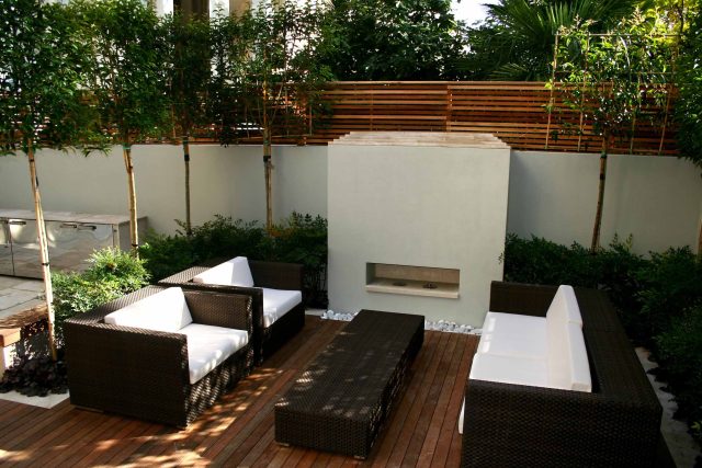 Contemporary outdoor garden space designed by Kate Gould and built by the Garden Builders, water feature, floating bench, cedar bench, landscaping contractors.