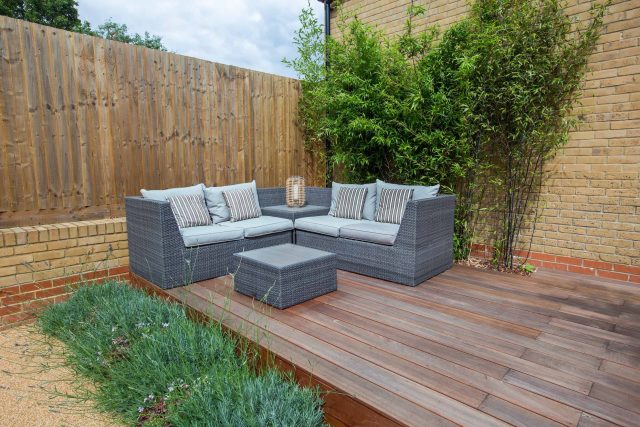Japanese style garden, designed and constructed by The Garden Builders floor levels and planting geometry white porcelain tiles landscape company wood decking.