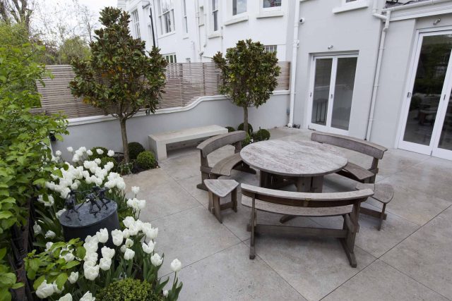 Contemporary yet elegant garden design in Notting Hill, with good entertaining space, slate water feature and sculpture, beautiful communal garden landscaper.