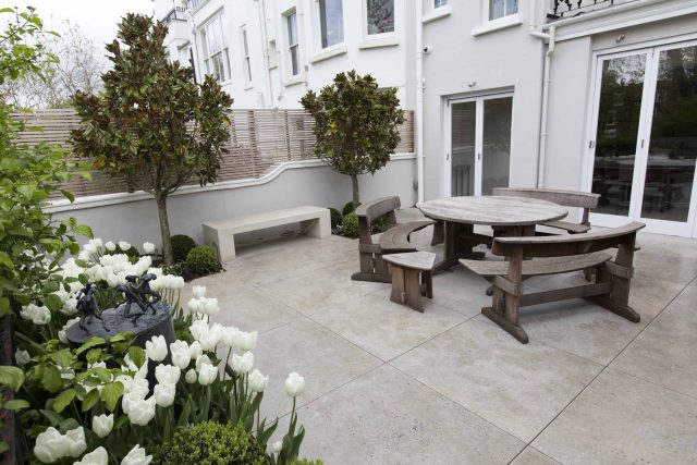 Contemporary yet elegant garden design in Notting Hill, with good entertaining space, slate water feature and sculpture, beautiful communal garden landscaper.