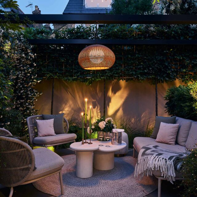 Walton On Thames garden designer outdoor kitchen dining metal pergola thoughtful planting