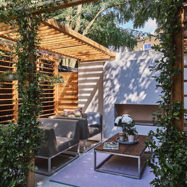 Tooting garden designer sophisticated outdoor retreat kitchen pergola contemporary features planting paving