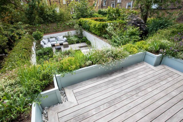 Roof garden courtyard designers building company London Islington planning roofers planting, sleek cubist-inspired, for effortless relaxation.